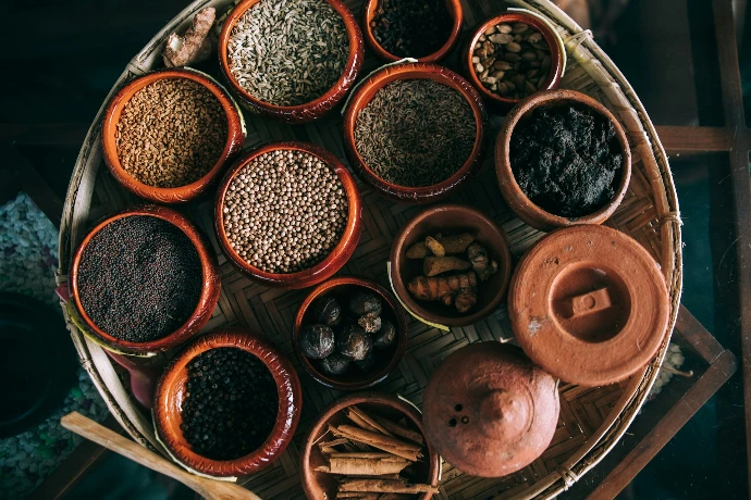 A tray of various spices is displayed.